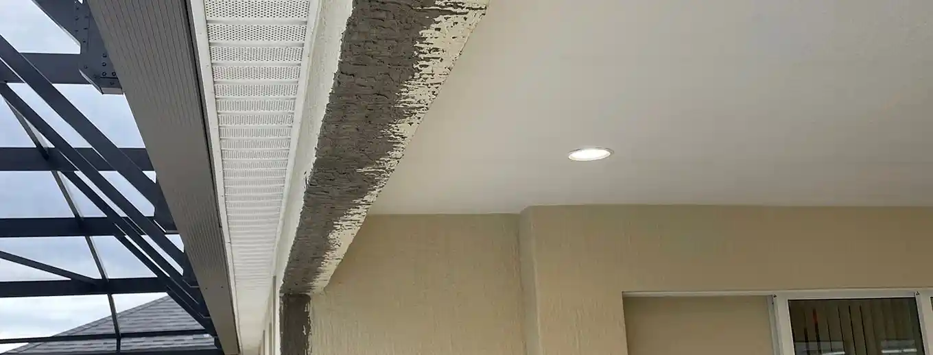 A stucco repair in progress on an occupied home