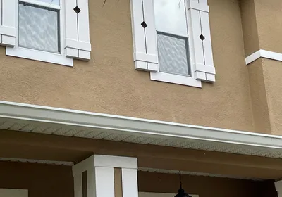 A finished, repainted stucco repair