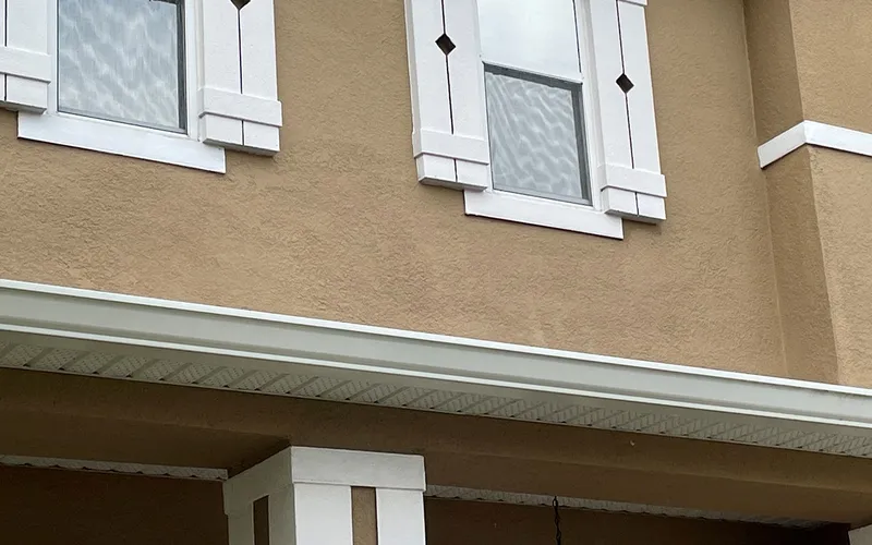 A finished, repainted stucco repair, Central Florida example