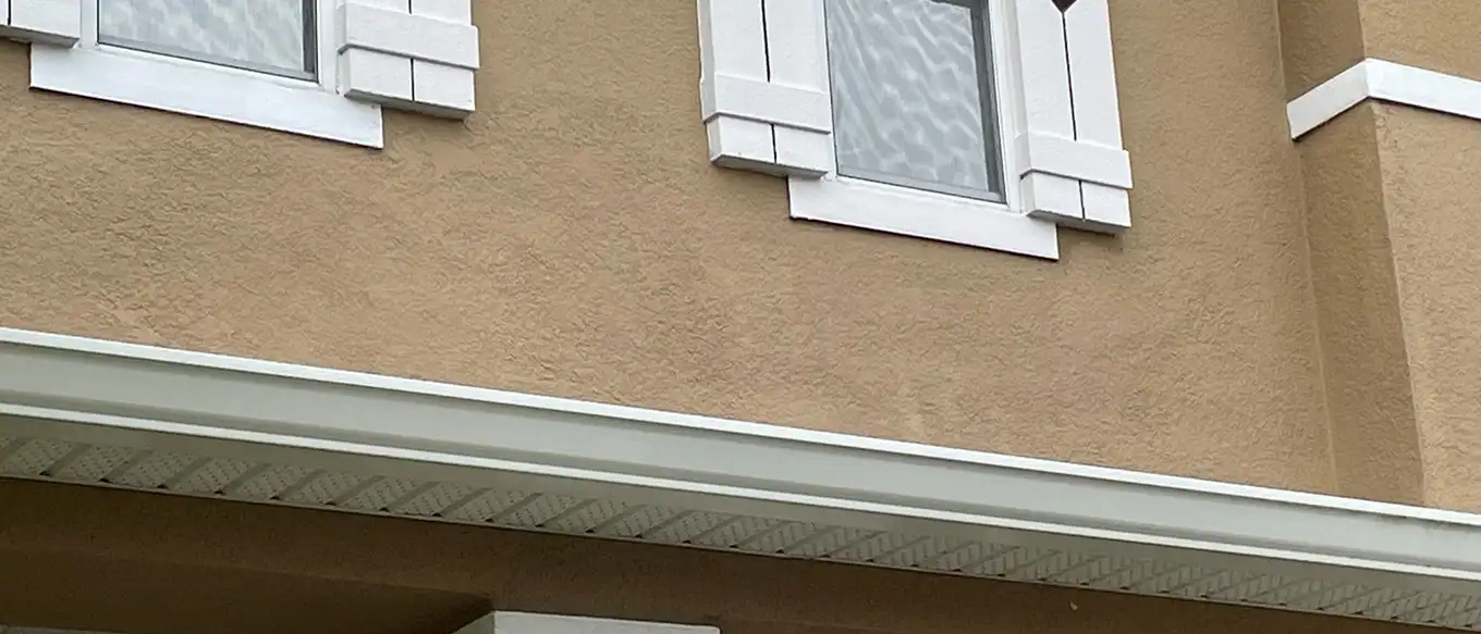 A finished, repainted stucco repair