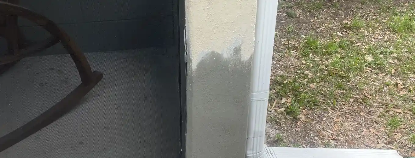 A stucco column base repaired and primed, Central Florida example