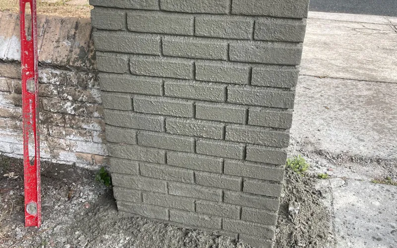 Brick coursing hand-tooled into fresh stucco, Central Florida example