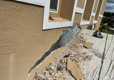 A stucco crack opened back to bare lath